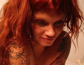 Petra has muscles, tattoos, and a big clit. And you can see them all in her bedroom.